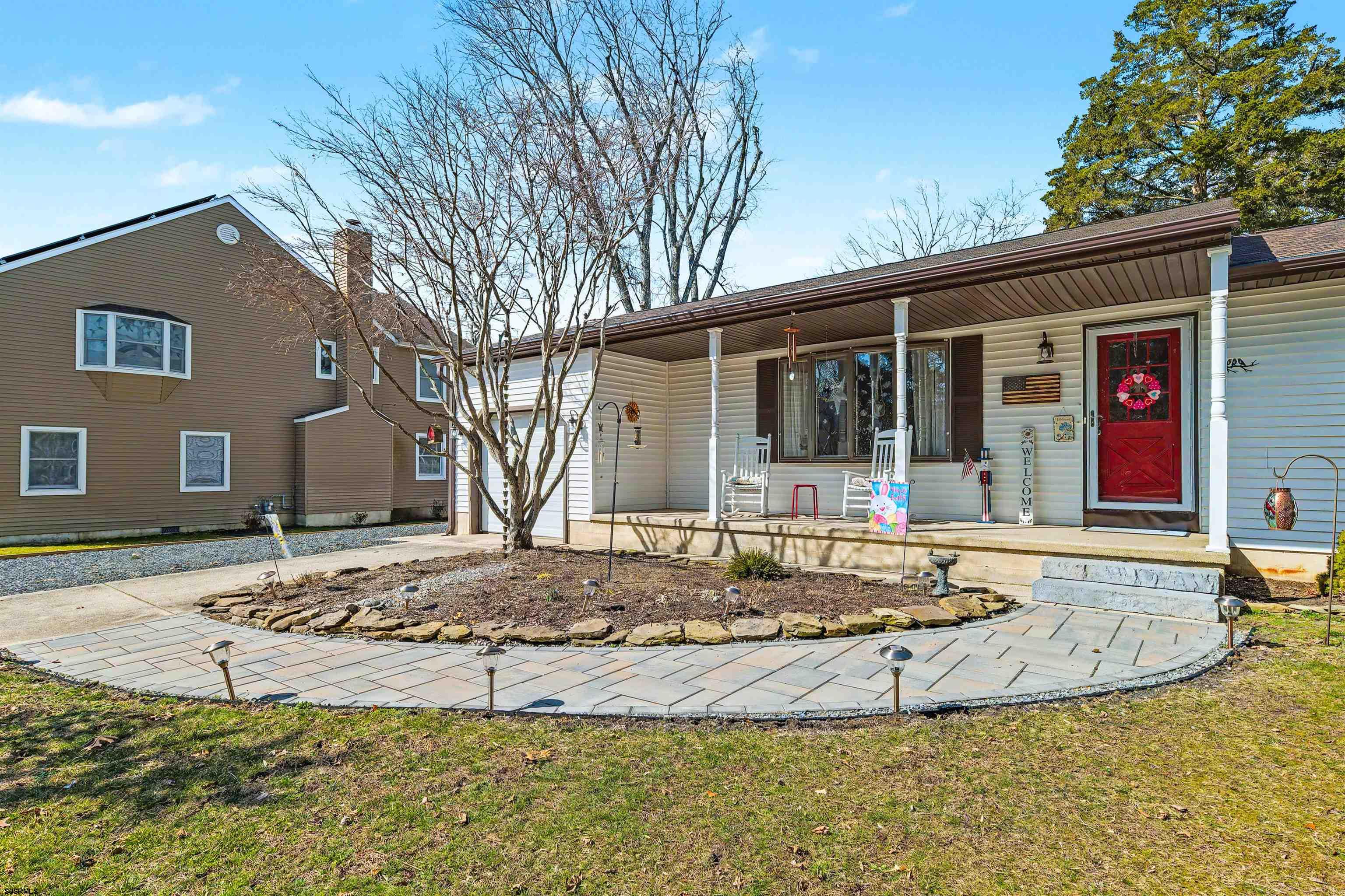 655 Weilers Lane Absecon, NJ 08201 - Photo 28 of 31 a view of a white house with a large tree