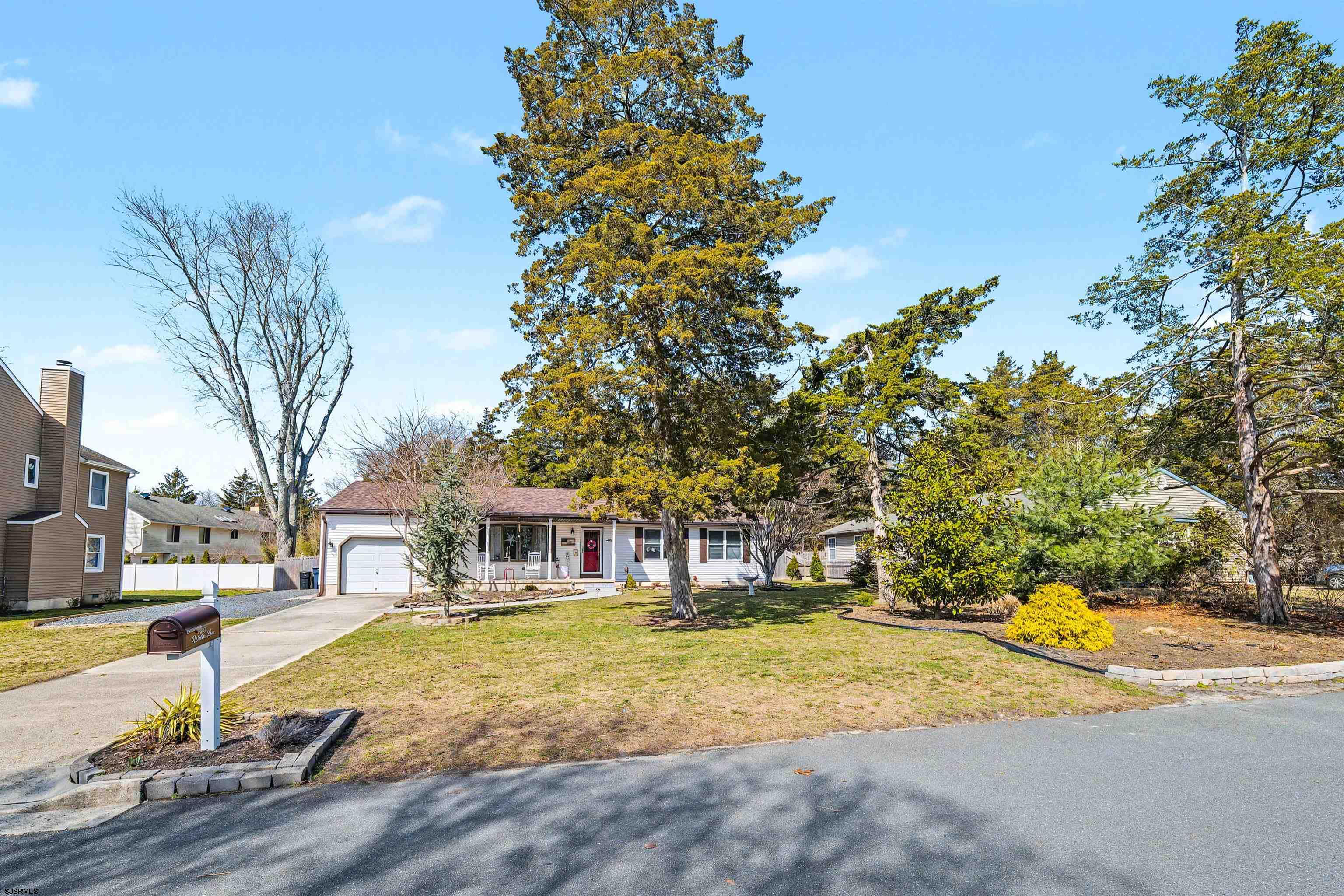 655 Weilers Lane Absecon, NJ 08201 - Photo 31 of 31 a house with palm tree in front of it