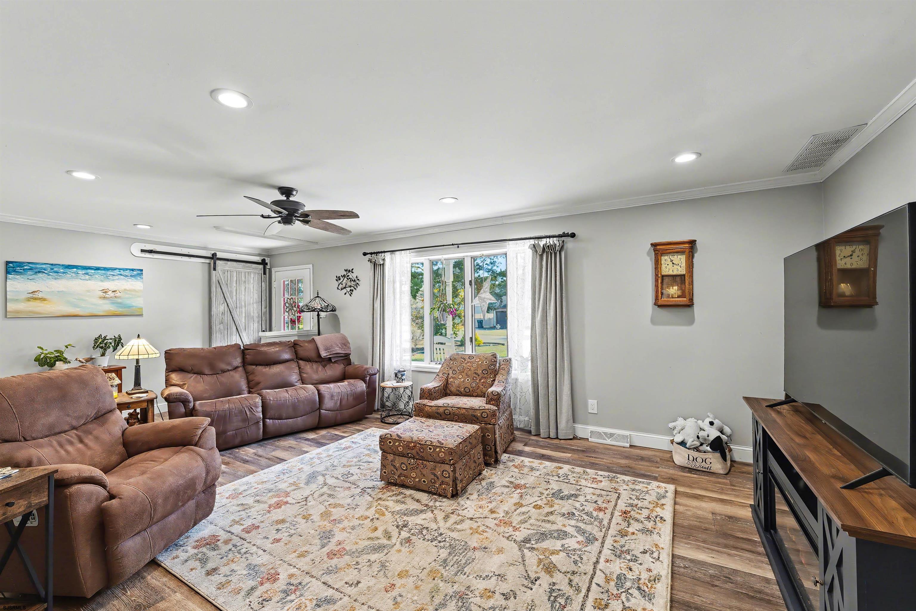 655 Weilers Lane Absecon, NJ 08201 - Photo 4 of 31 a living room with furniture and a flat screen tv