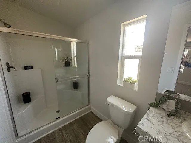 a bathroom with a shower and toilet