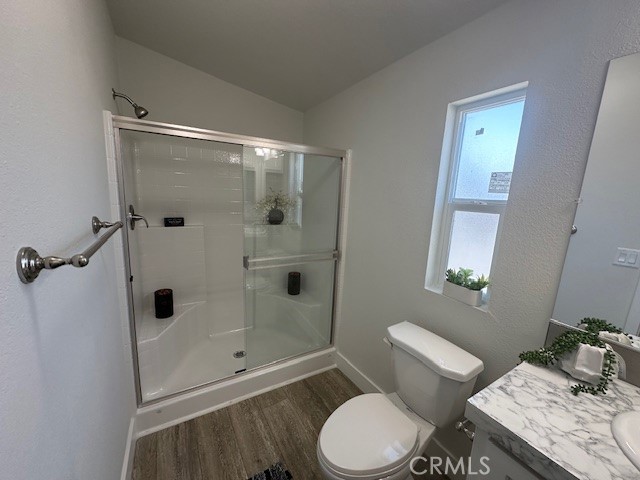 43601 East Florida Avenue, Unit 43 Hemet, CA 92544 - Photo 15 of 21 a bathroom with a toilet a sink and shower