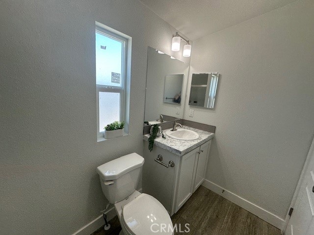 43601 East Florida Avenue, Unit 43 Hemet, CA 92544 - Photo 16 of 21 a bathroom with a toilet sink and mirror