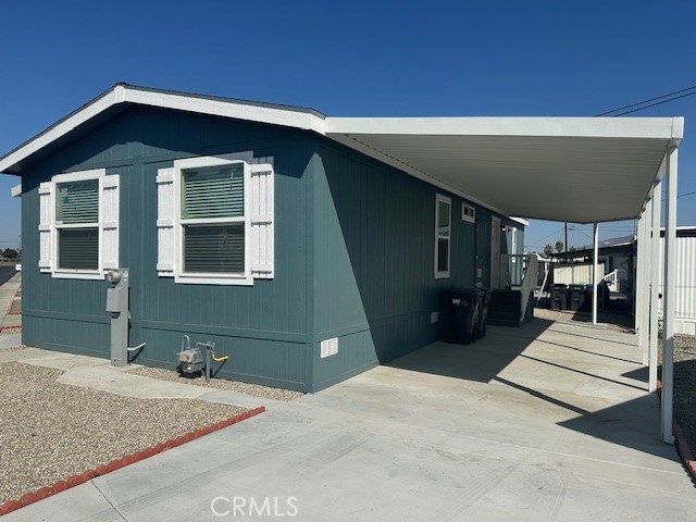 43601 East Florida Avenue, Unit 43 Hemet, CA 92544 - Photo 2 of 21 a front view of a house with a yard