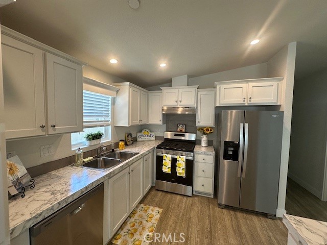 43601 East Florida Avenue, Unit 43 Hemet, CA 92544 - Photo 21 of 21 a kitchen with stainless steel appliances granite countertop a stove a sink a refrigerator and a microwave