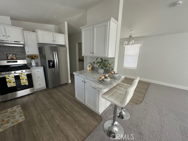 43601 East Florida Avenue, Unit 43 Hemet, CA 92544 - Photo 5 of 21 a kitchen with stainless steel appliances granite countertop a refrigerator a stove a sink and a stove