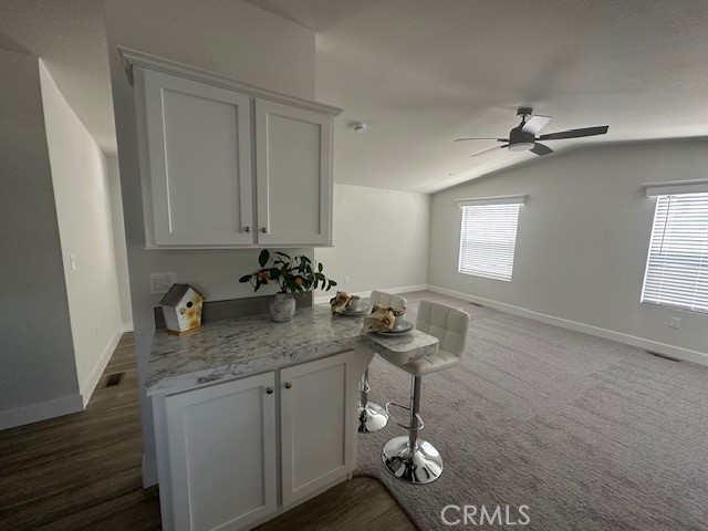 43601 East Florida Avenue, Unit 43 Hemet, CA 92544 - Photo 9 of 21 a bathroom with a granite countertop sink a mirror and a shower