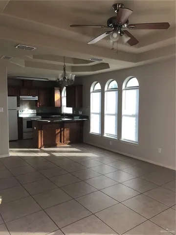 a view of a kitchen with a sink and a large window