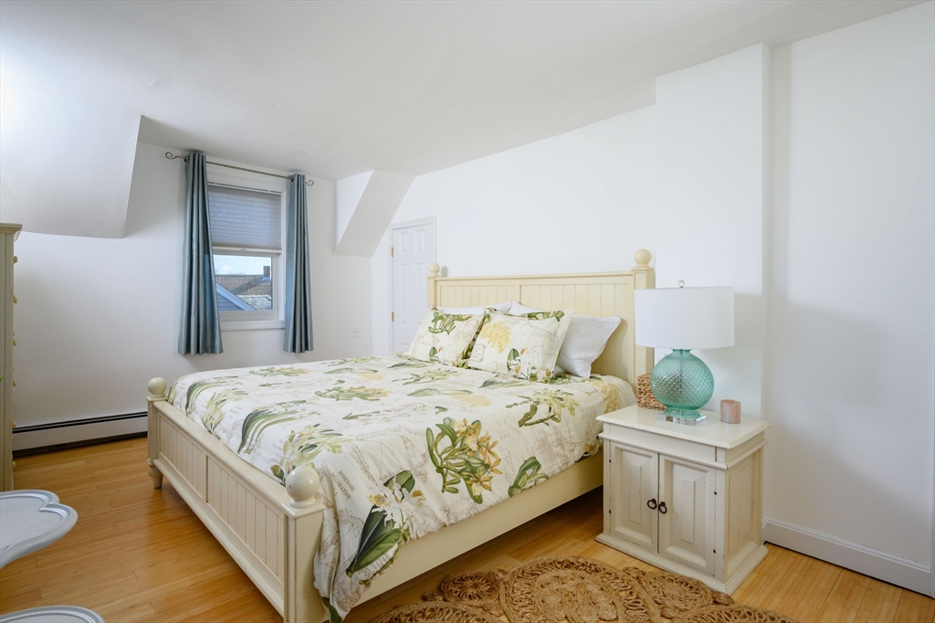 18 Standish Road Hull, MA 02045 - Photo 19 of 35 a bed sitting in a bedroom next to a window