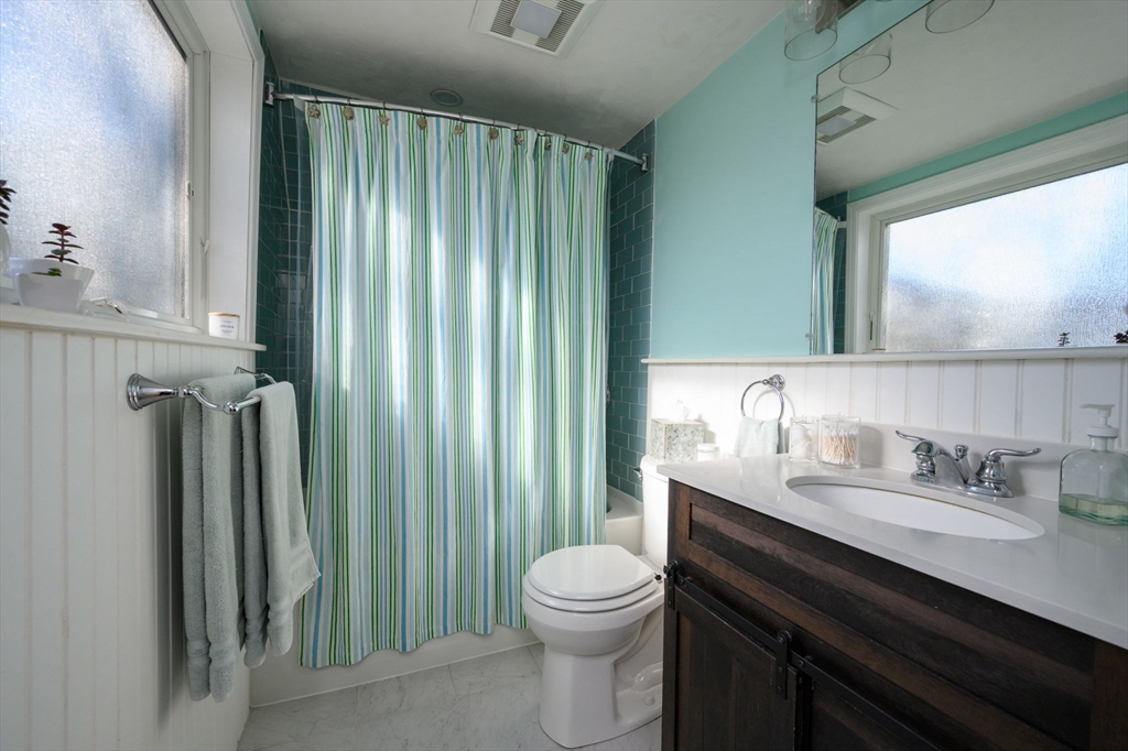 18 Standish Road Hull, MA 02045 - Photo 22 of 35 a bathroom with a granite countertop sink toilet and shower