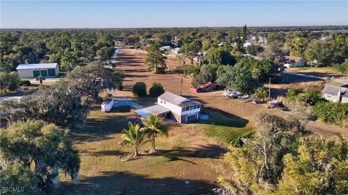 2111 Gardner Court Alva, FL 33920 - Photo 12 of 47 an aerial view of a house with a yard basket ball court and outdoor seating
