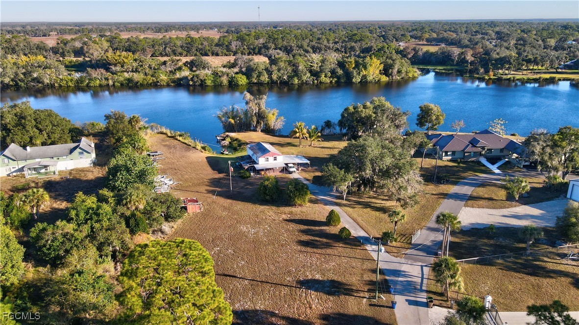 2111 Gardner Court Alva, FL 33920 - Photo 32 of 47 an aerial view of a house with a lake view