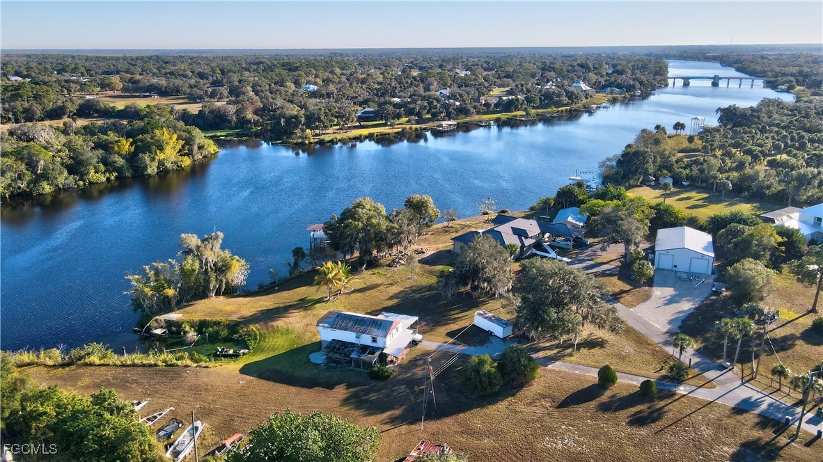 2111 Gardner Court Alva, FL 33920 - Photo 33 of 47 an aerial view of lake residential house with outdoor space