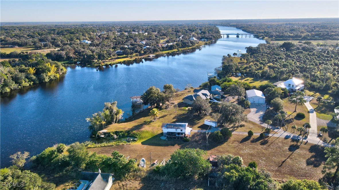 2111 Gardner Court Alva, FL 33920 - Photo 34 of 47 an aerial view of a house with a lake view
