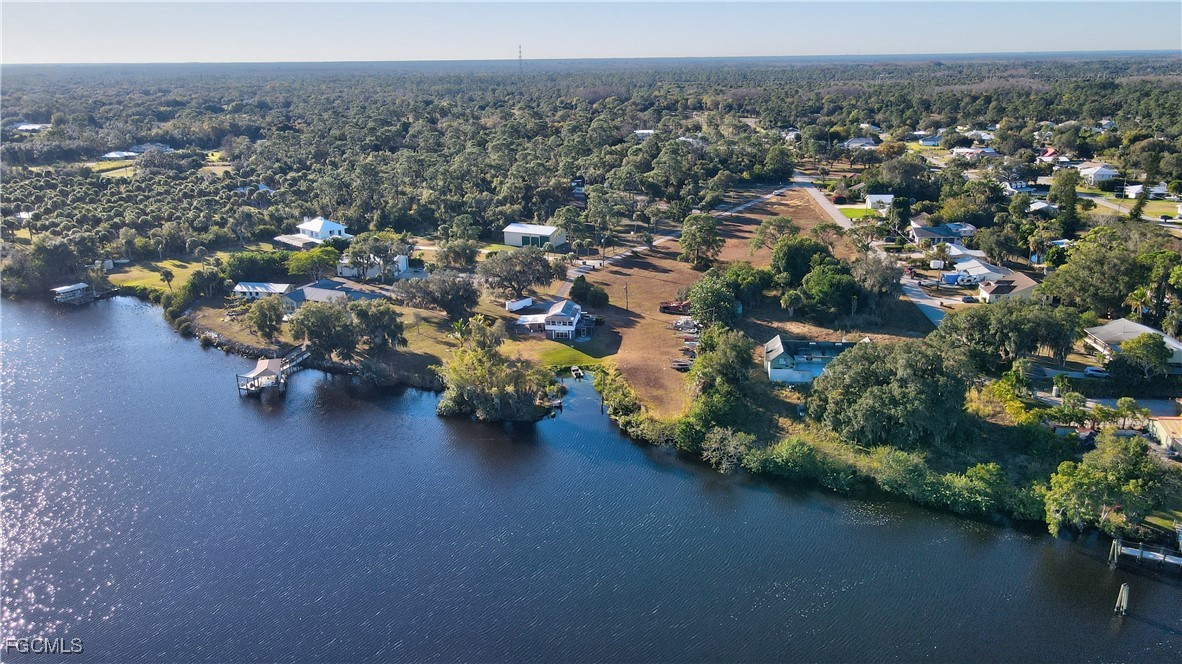 2111 Gardner Court Alva, FL 33920 - Photo 36 of 47 an aerial view of a house with a garden and lake view