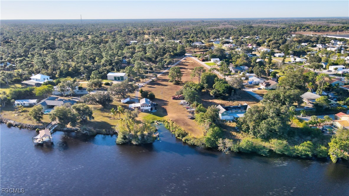 2111 Gardner Court Alva, FL 33920 - Photo 37 of 47 an aerial view of a houses with a yard and lake view