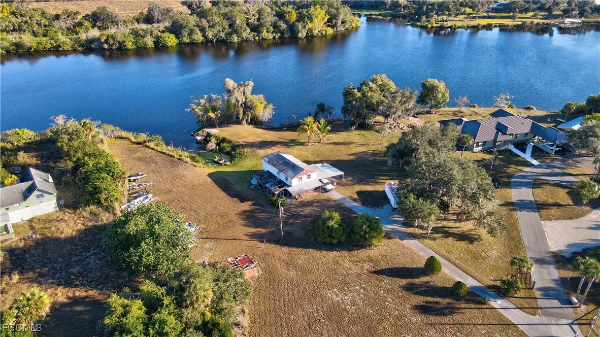 2111 Gardner Court Alva, FL 33920 - Photo 40 of 47 an aerial view of a house with a lake view