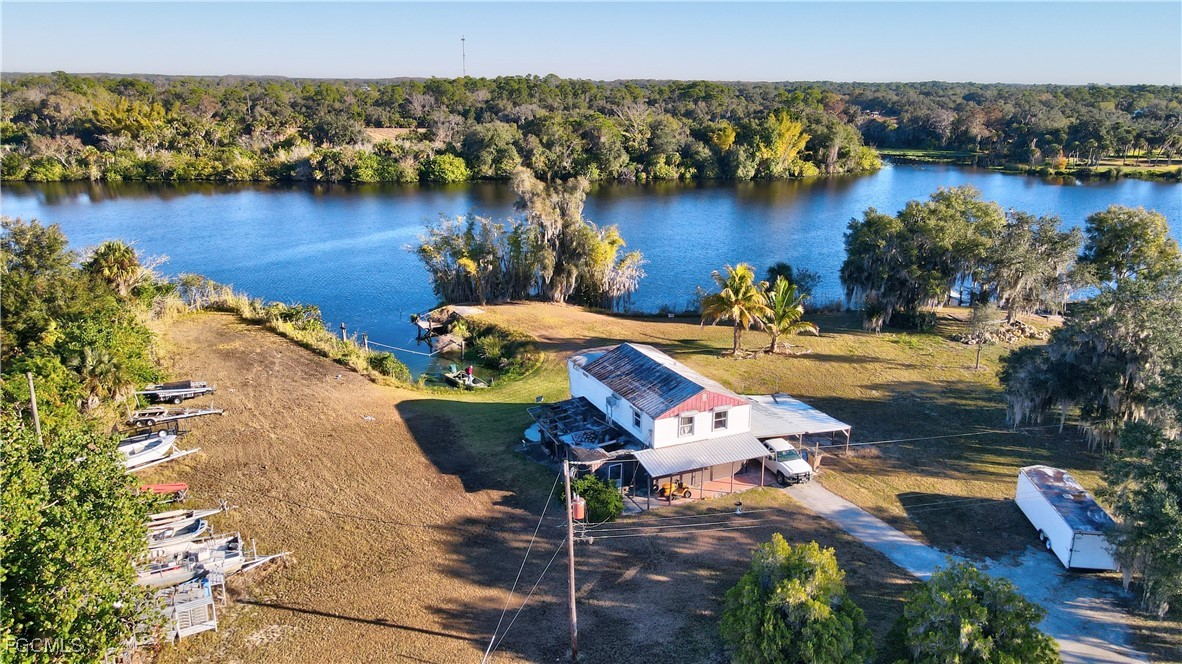 2111 Gardner Court Alva, FL 33920 - Photo 41 of 47 an aerial view of a house with a lake view