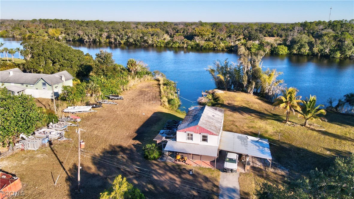 2111 Gardner Court Alva, FL 33920 - Photo 42 of 47 an aerial view of a house with a lake view