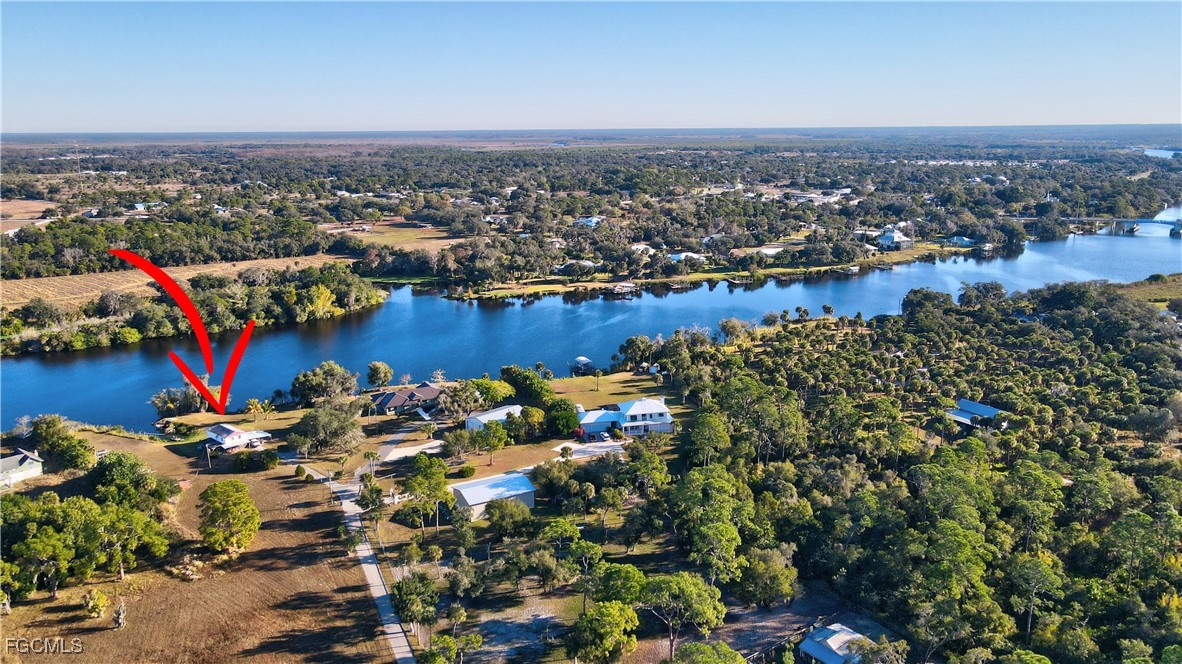 2111 Gardner Court Alva, FL 33920 - Photo 5 of 47 an aerial view of a houses with a lake view