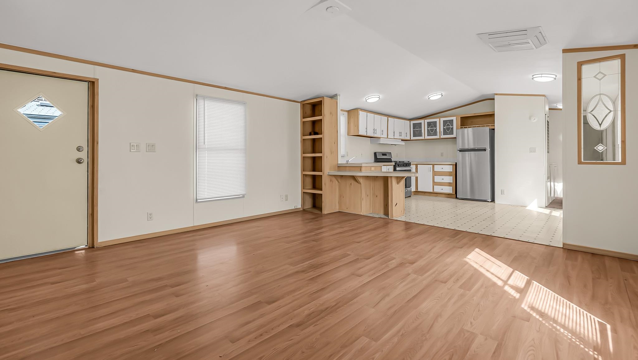 534 Normandy Way Grand Junction, CO 81501 - Photo 12 of 32 a view of a kitchen with a sink and a refrigerator