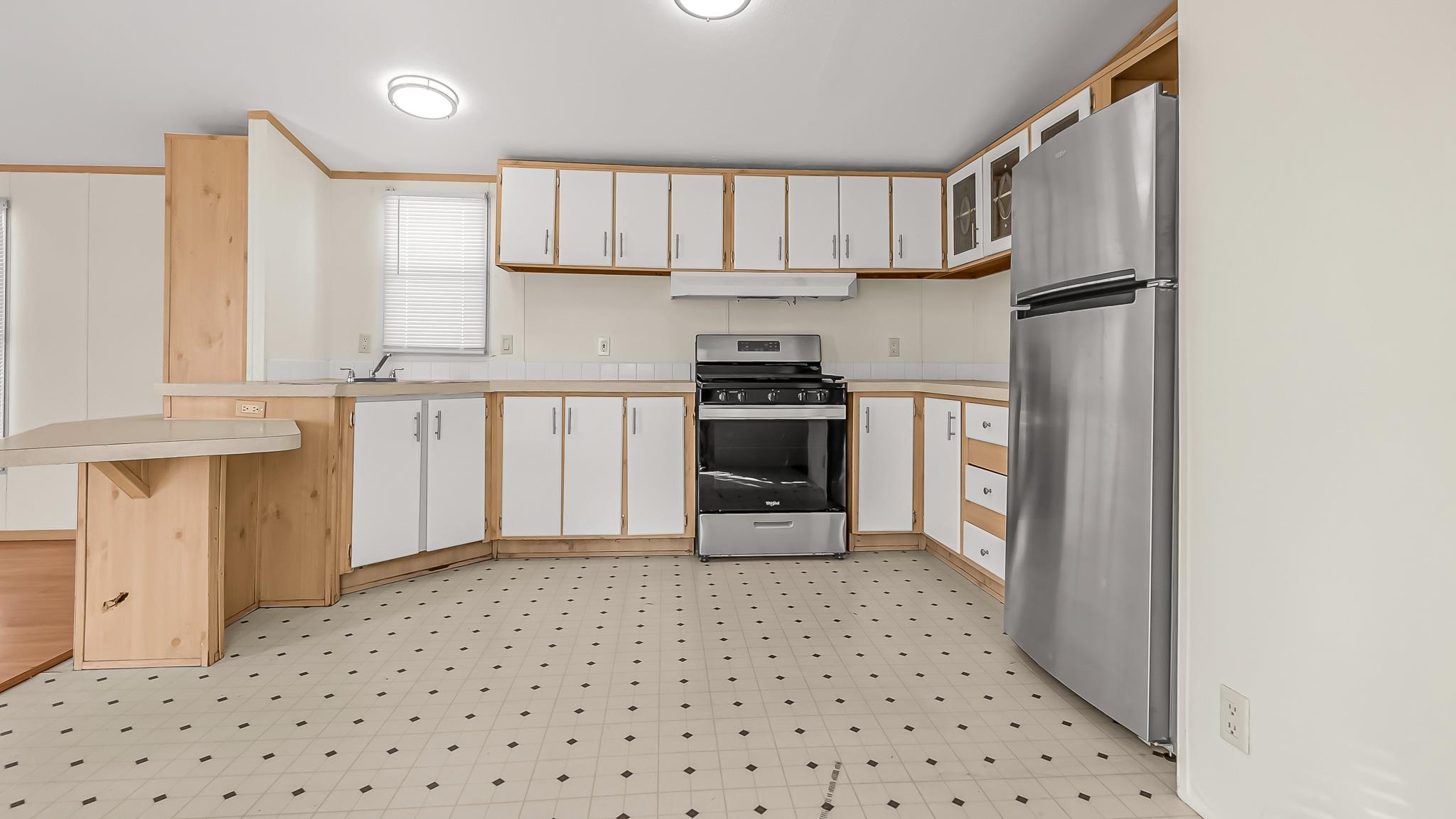 534 Normandy Way Grand Junction, CO 81501 - Photo 16 of 32 a kitchen with granite countertop a refrigerator stove top oven and sink