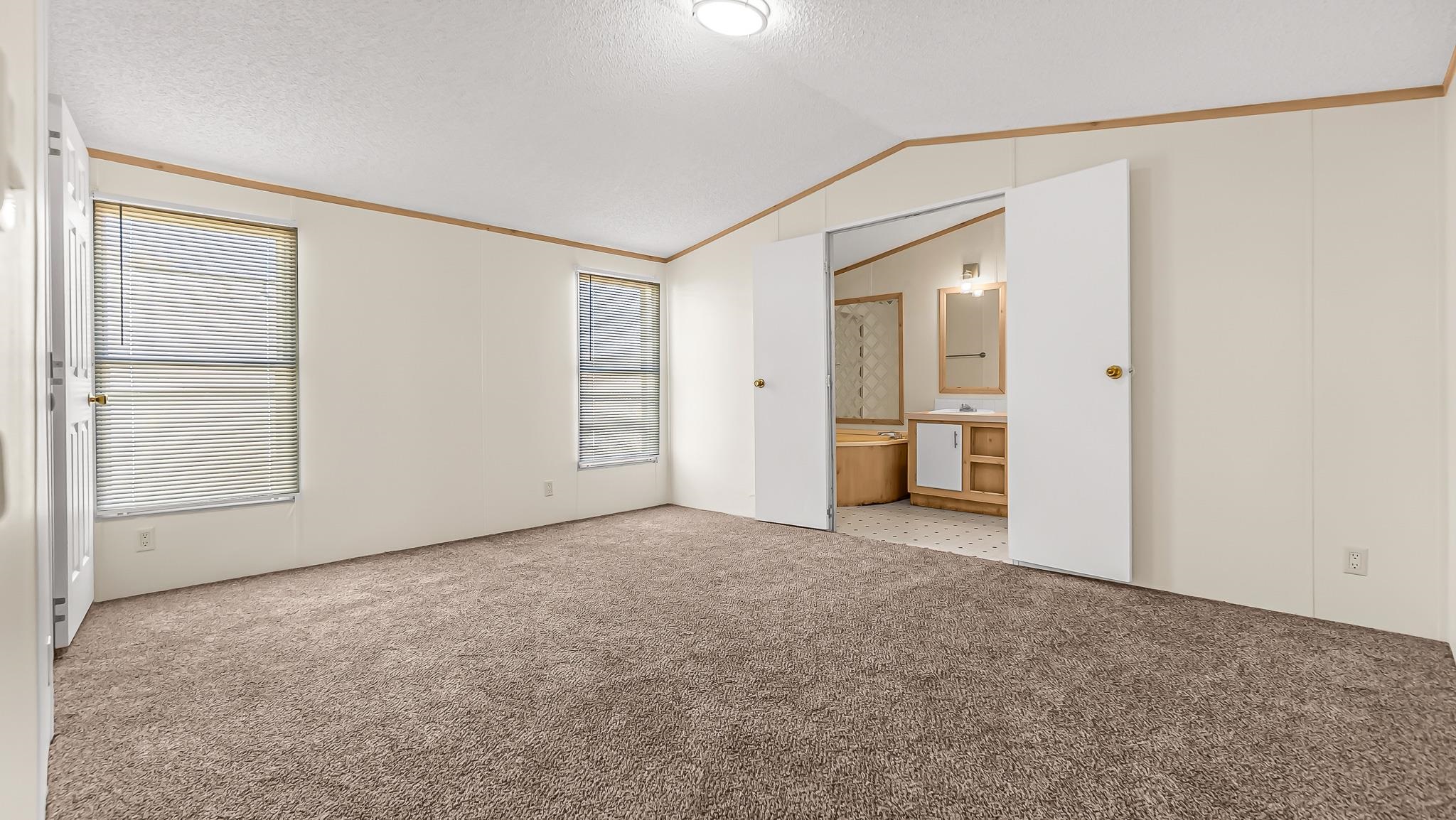 534 Normandy Way Grand Junction, CO 81501 - Photo 18 of 32 a view of empty room with wooden floor and cabinet