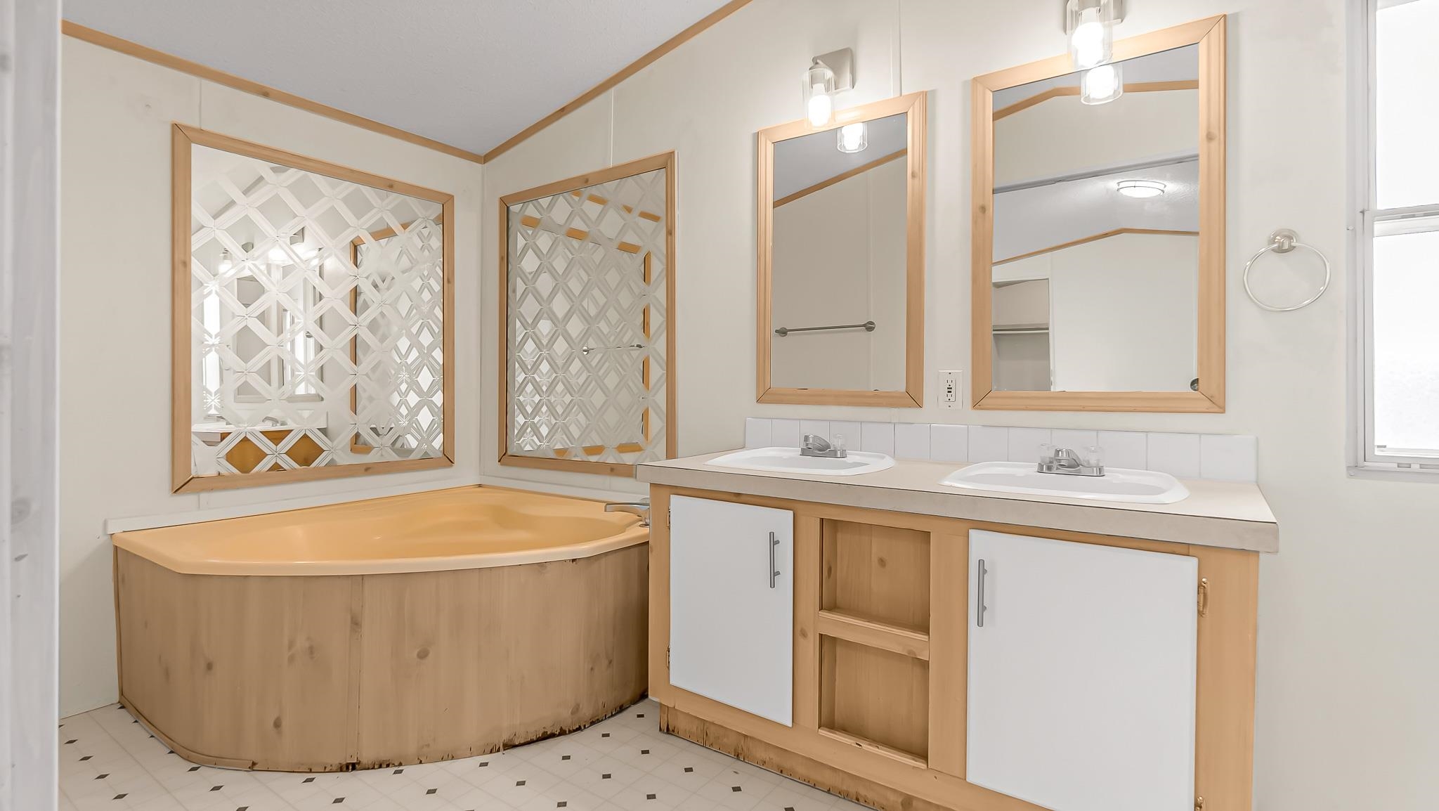 534 Normandy Way Grand Junction, CO 81501 - Photo 20 of 32 a bathroom with a tub sink and mirror