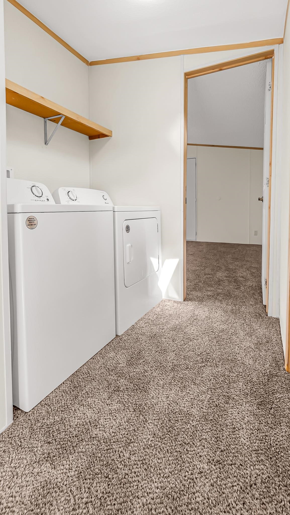 534 Normandy Way Grand Junction, CO 81501 - Photo 21 of 32 a view of a utility room with closet and wooden floor