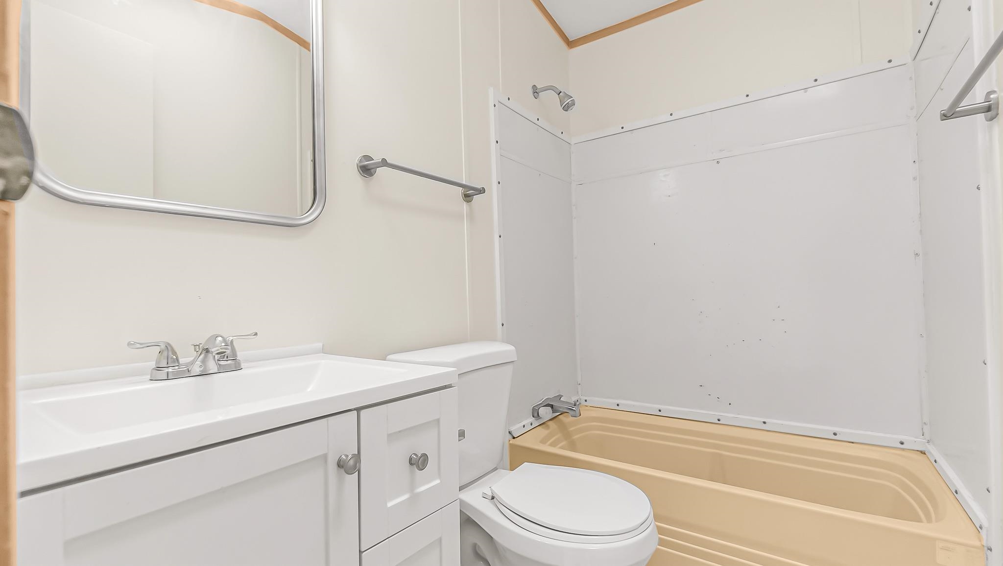 534 Normandy Way Grand Junction, CO 81501 - Photo 25 of 32 a bathroom with a sink a toilet and shower