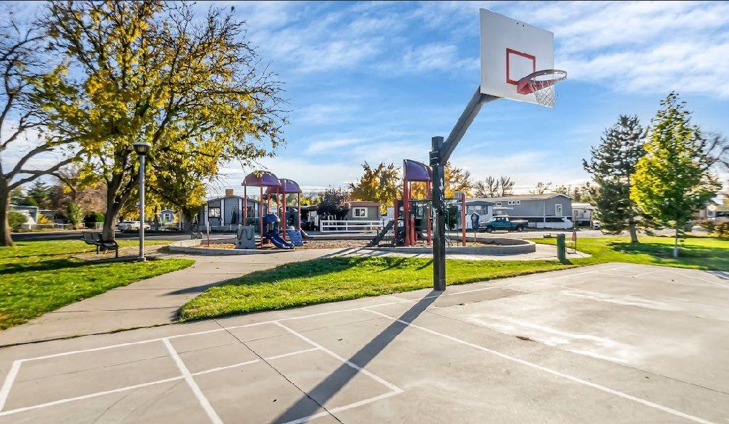 534 Normandy Way Grand Junction, CO 81501 - Photo 6 of 32 a view of a swimming pool with a yard and sitting area