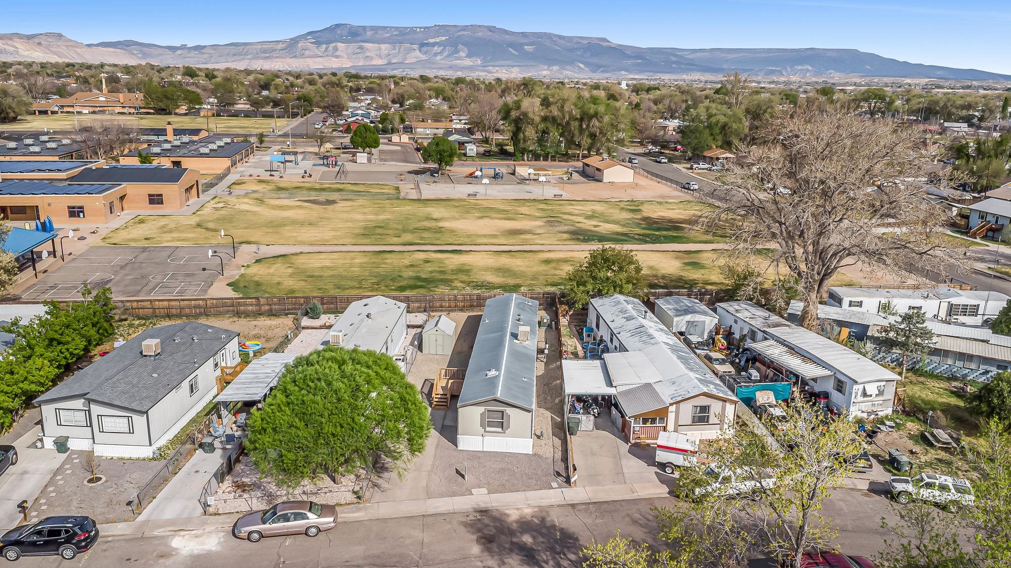 534 Normandy Way Grand Junction, CO 81501 - Photo 8 of 32 an aerial view of residential houses with outdoor space and trees