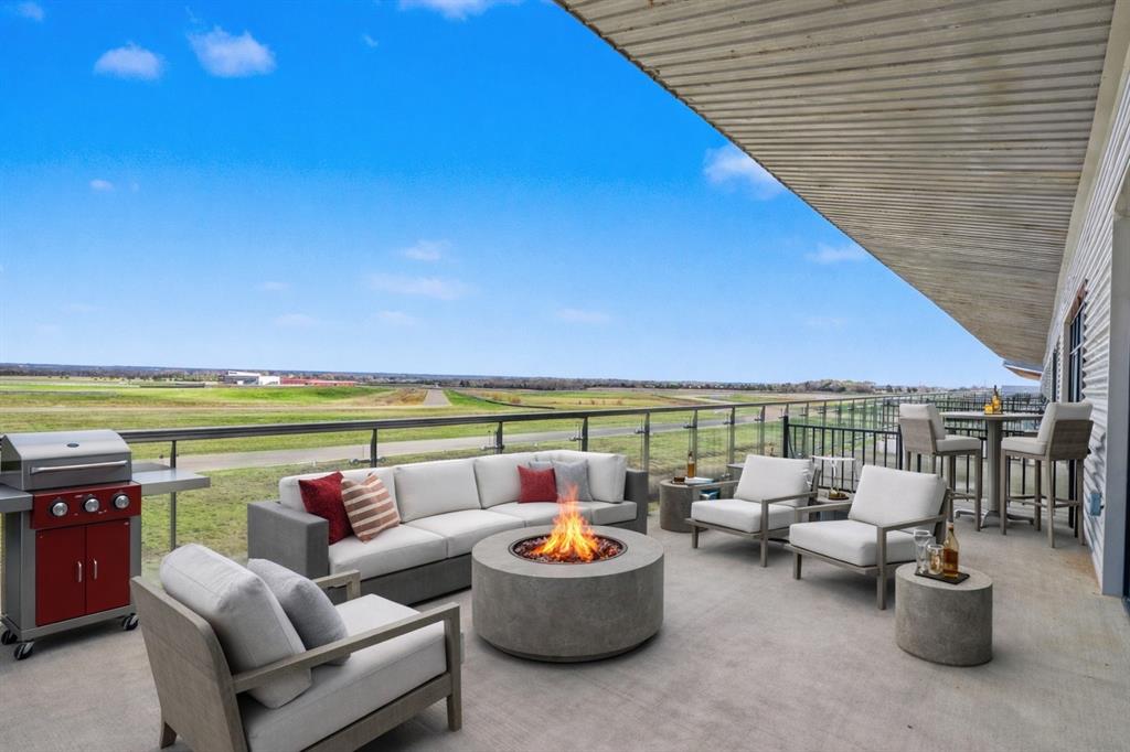 400 Fast Lane, Unit 9 Anna, TX 75409 - Photo 19 of 37 View of patio / terrace featuring an outdoor living space with a fire pit and area for grilling