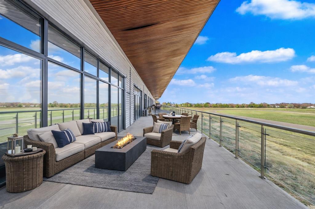 400 Fast Lane, Unit 9 Anna, TX 75409 - Photo 21 of 37 View of patio featuring golf course view, outdoor lounge area, and an outdoor fire pit
