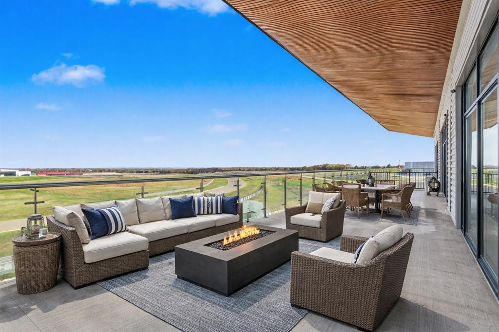 400 Fast Lane, Unit 9 Anna, TX 75409 - Photo 22 of 37 View of patio / terrace with an outdoor living / dining area and an outdoor fire pit