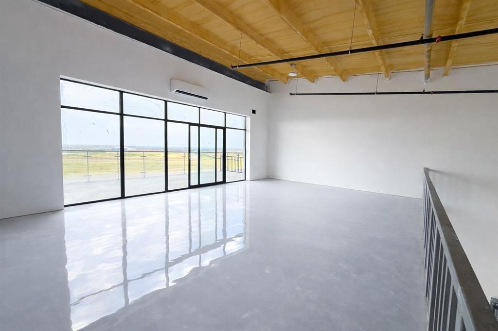 400 Fast Lane, Unit 9 Anna, TX 75409 - Photo 34 of 37 Unfurnished room with concrete flooring, a wooden ceiling with exposed beams, and a mini split for heating / cooling