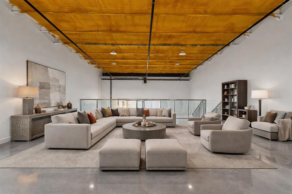 400 Fast Lane, Unit 9 Anna, TX 75409 - Photo 7 of 37 Living area with finished concrete floors and wood ceiling