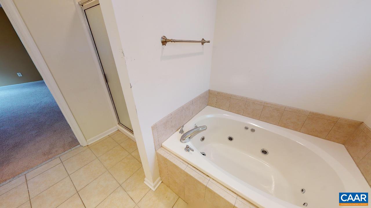 9 Tanglewood Road Palmyra, VA 22963 - Photo 15 of 34 a bathroom with a bathtub