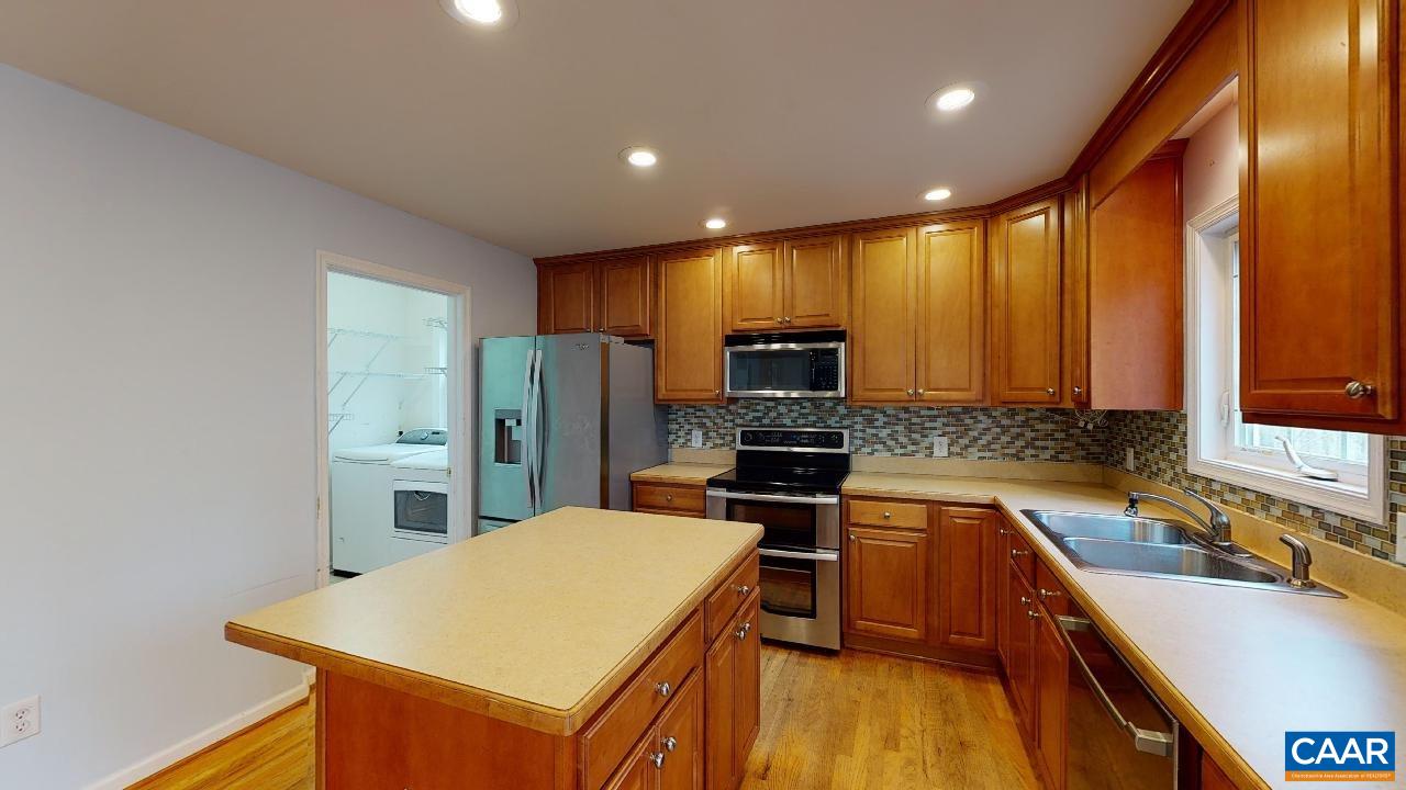 9 Tanglewood Road Palmyra, VA 22963 - Photo 7 of 34 a kitchen with stainless steel appliances a refrigerator sink and microwave