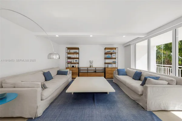 a living room with furniture and a table
