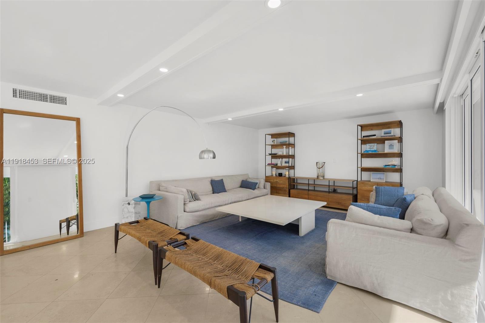 605 Ocean Drive, Unit 2L Key Biscayne, FL 33149 - Photo 7 of 46 a living room with furniture and a table