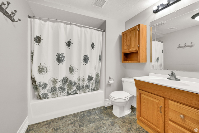 4792 Glasmann Way South Ogden, UT 84403 - Photo 63 of 70 Full bathroom featuring a single vanity with wood-finish cabinetry including a medicine cabinet, a white basin, and a mirror