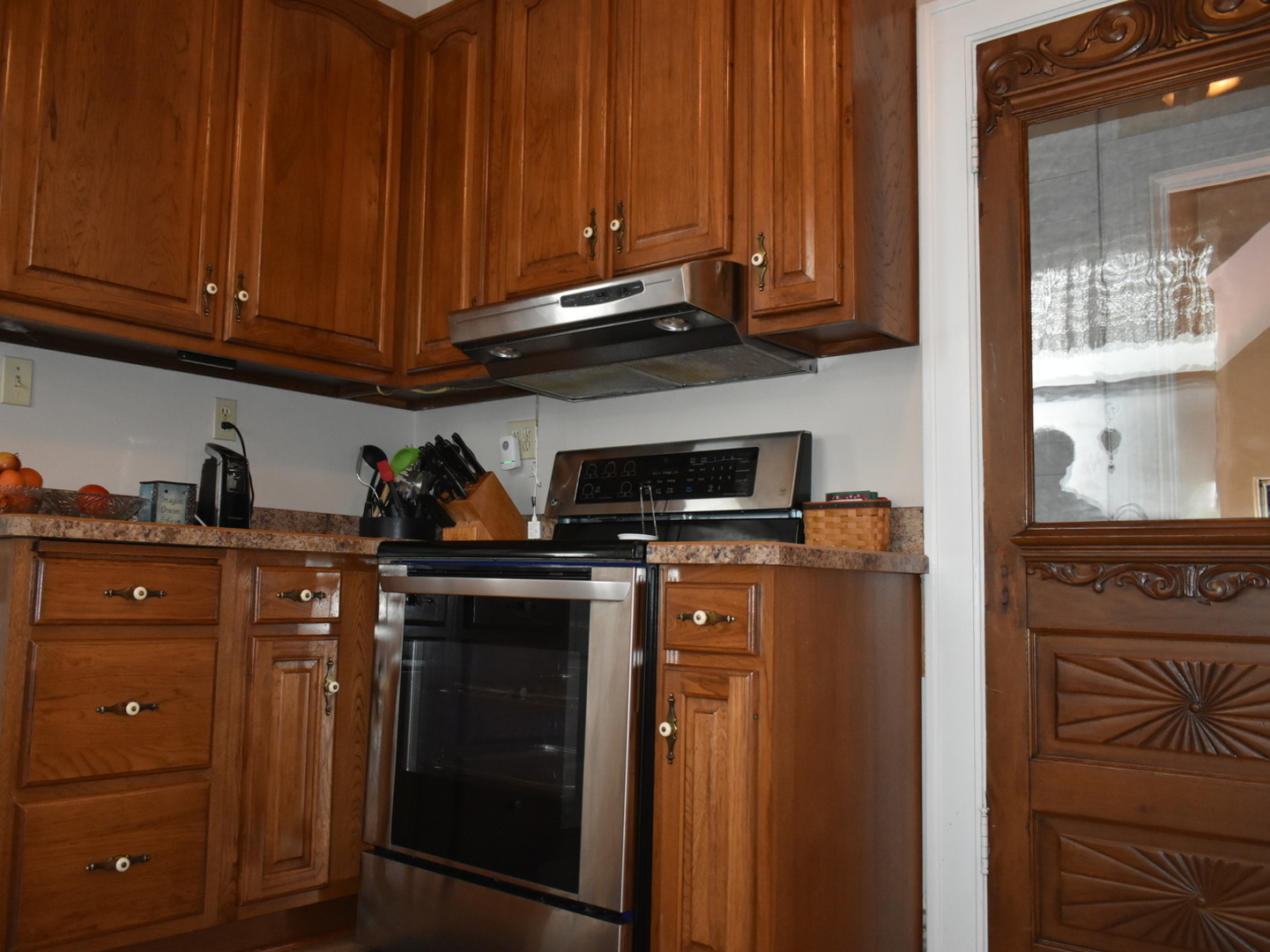330 East Locust Street Watseka, IL 60970 - Photo 11 of 72 a kitchen with stainless steel appliances granite countertop a refrigerator and a stove top oven