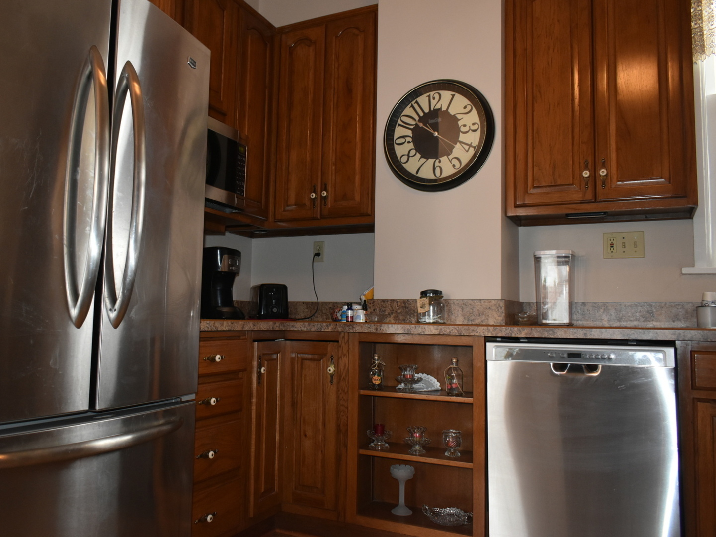 330 East Locust Street Watseka, IL 60970 - Photo 14 of 72 a kitchen with stainless steel appliances granite countertop a refrigerator a stove and a sink with wooden cabinet