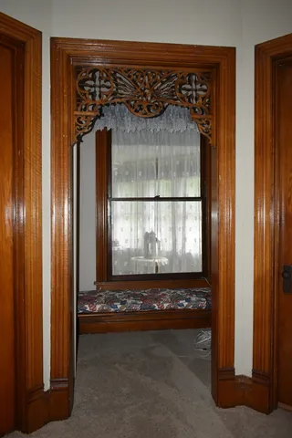 a bathroom with a bathtub and a window