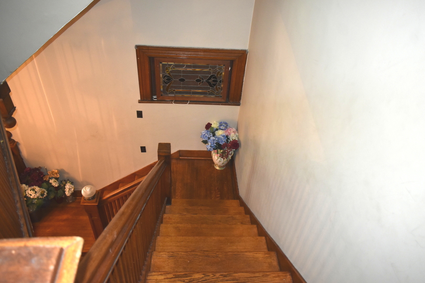 330 East Locust Street Watseka, IL 60970 - Photo 33 of 72 a hallway with wooden floor and stairs