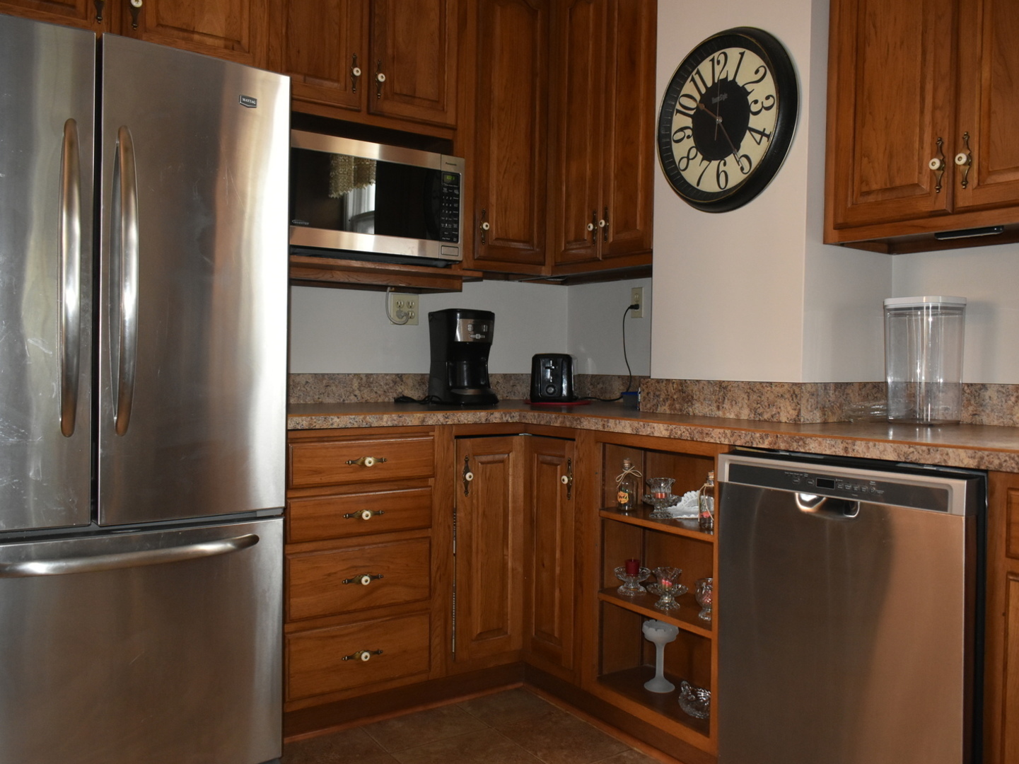 330 East Locust Street Watseka, IL 60970 - Photo 9 of 72 a kitchen with stainless steel appliances granite countertop a refrigerator a stove top oven and a sink