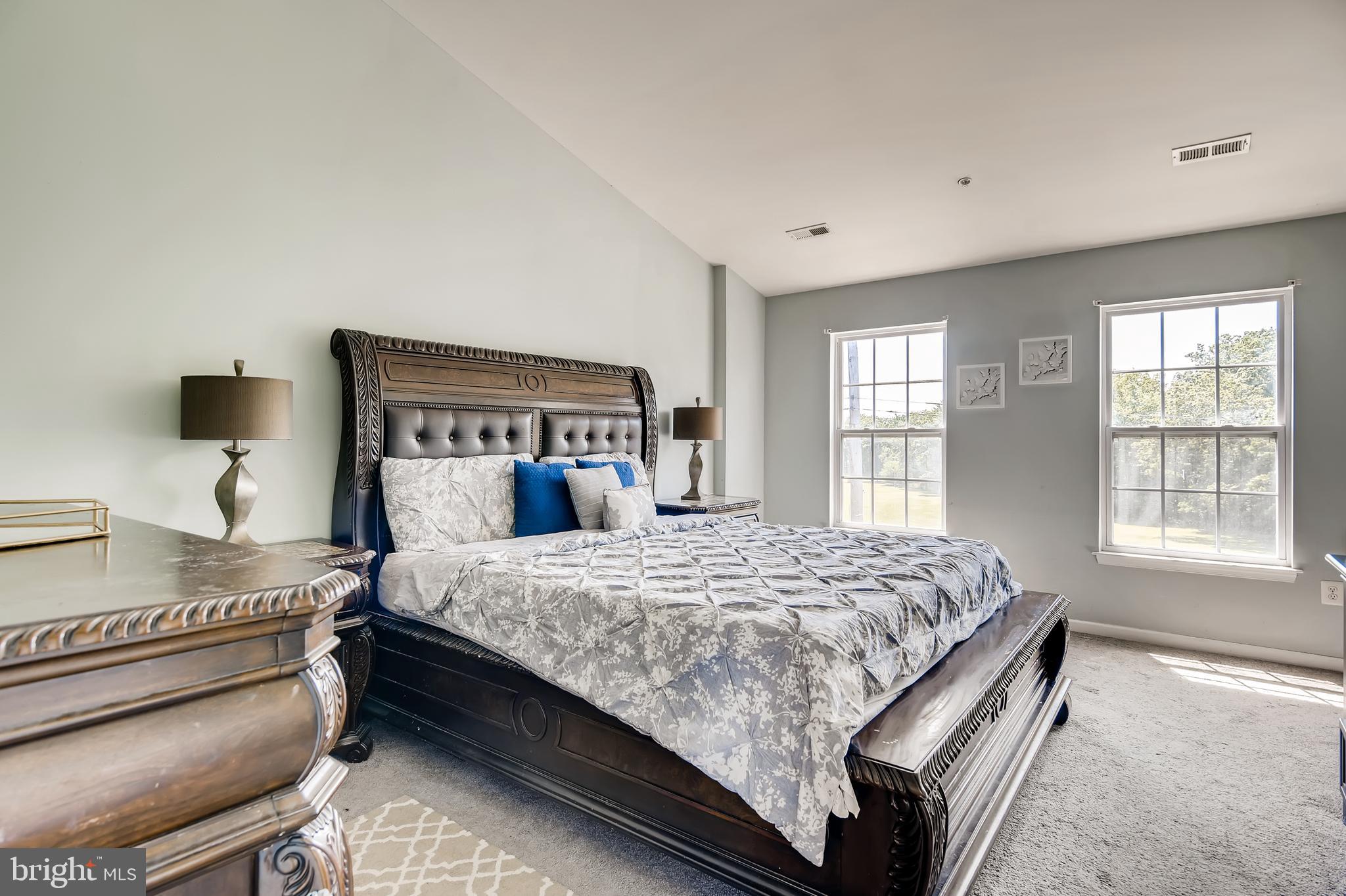 875 Middle River Road Baltimore, MD 21220 - Photo 14 of 28 a bedroom with a bed and window