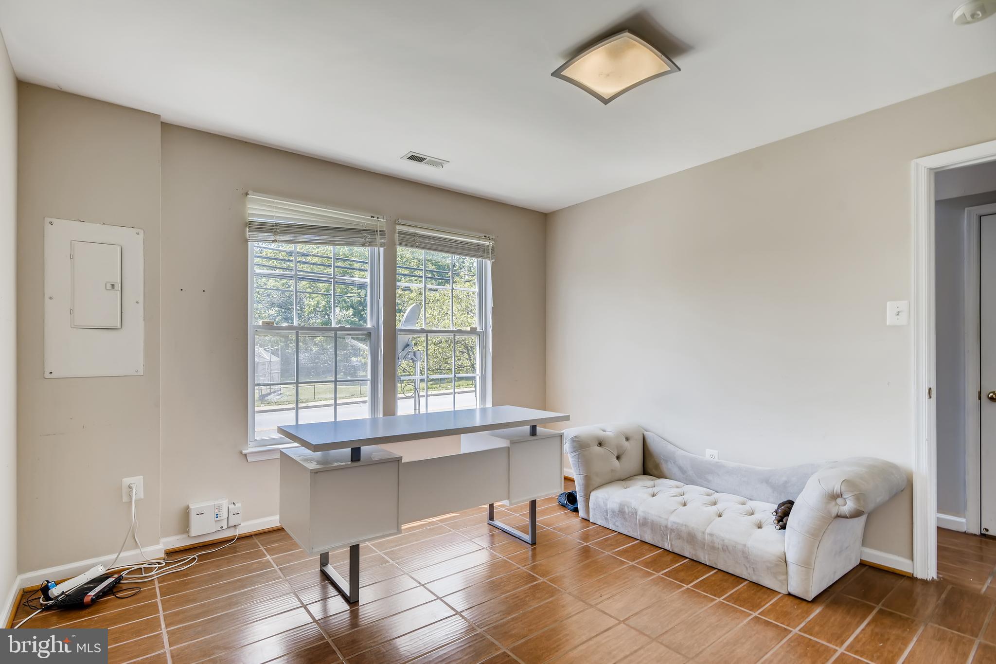 875 Middle River Road Baltimore, MD 21220 - Photo 22 of 28 a living room with furniture and a window