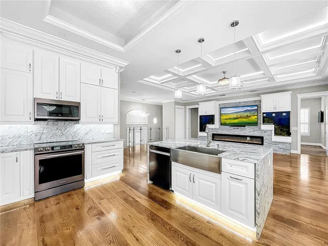 a view of living room with granite countertop furniture and floor to ceiling window