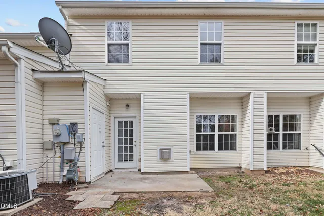 a front view of a house with a large window